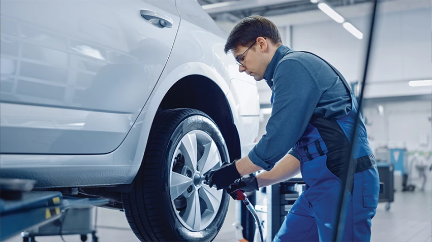 Mechanic working on an EV.