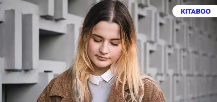 Attractive young woman draws with a pencil on a digital tablet blog