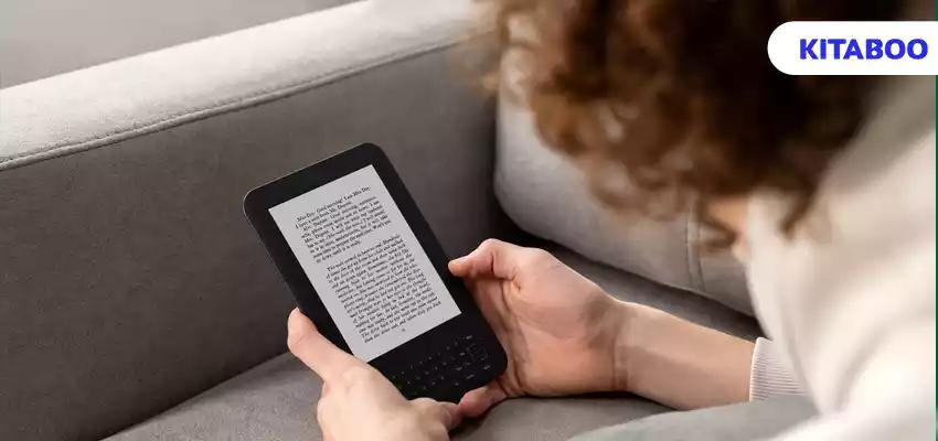 High angle man reading digital magazine