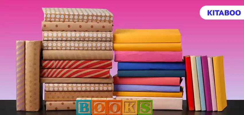 Stack of books on black wooden table blogggggg