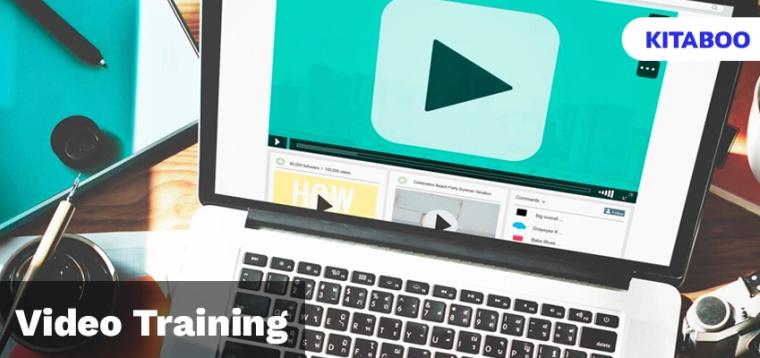 Hand typing on laptop with play button on screen blog
