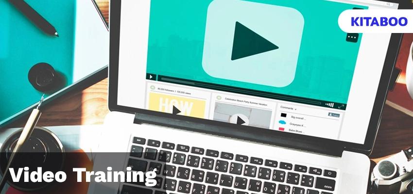 Hand typing on laptop with play button on screen blog