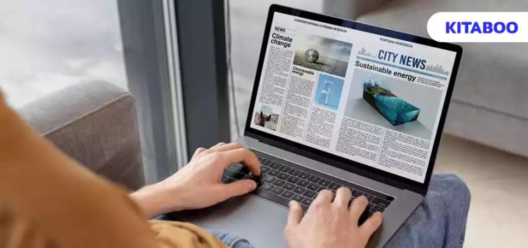 High angle man reading digital magazine
