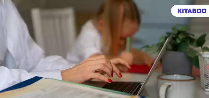 Mother working from home trying to balance family life with child and job blogg