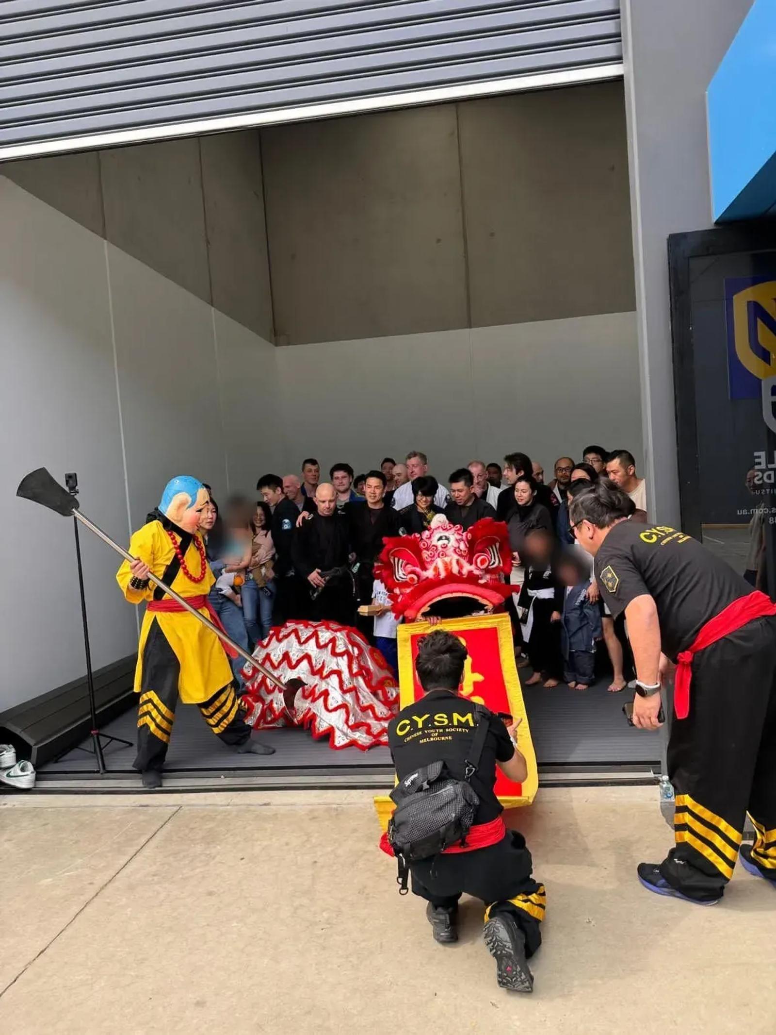 The lion dance at the doors of Noble Grounds BJJ on opening day