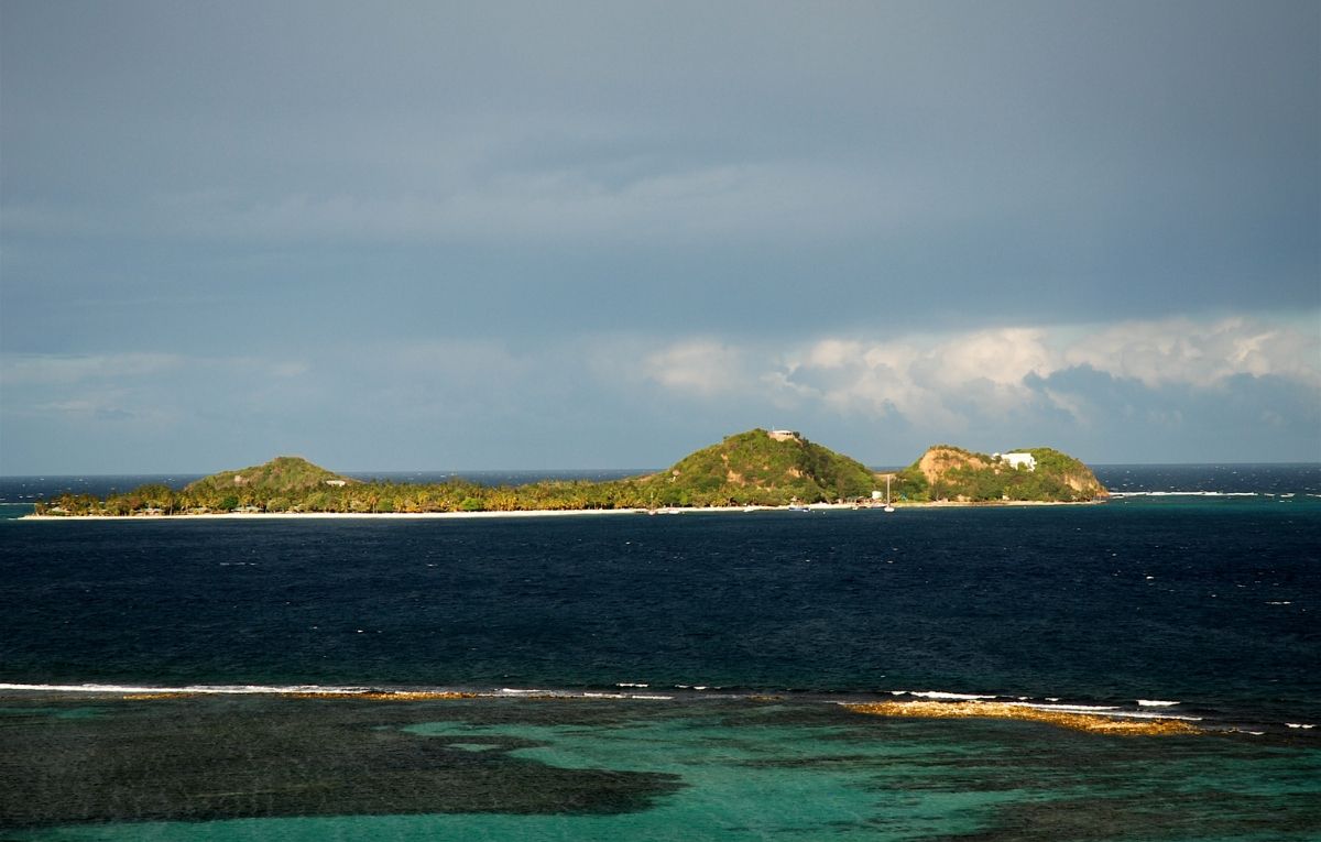 Picture of Palm Island, a resort island off the coast of Union Island, Saint Vincent and the Grenadines; as seen from Union Island looking eastward. Picture by Iain Grant, May 2007.