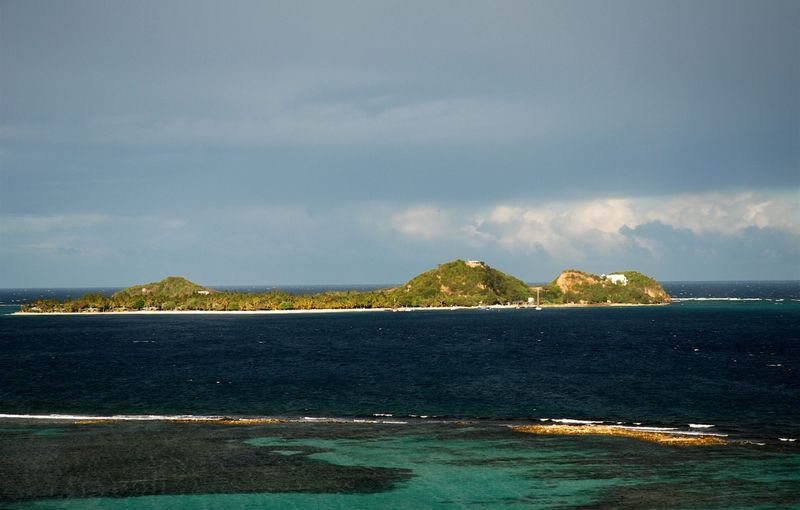 Picture of Palm Island, a resort island off the coast of Union Island, Saint Vincent and the Grenadines; as seen from Union Island looking eastward. Picture by Iain Grant, May 2007.
