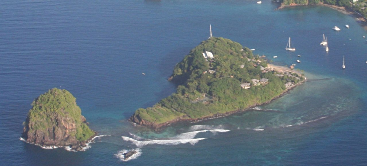 White Island wth Fort Duvernette in the foreground and Arnos Vale and the cricket stadium in the distance (photo by Ian Mackenzie)