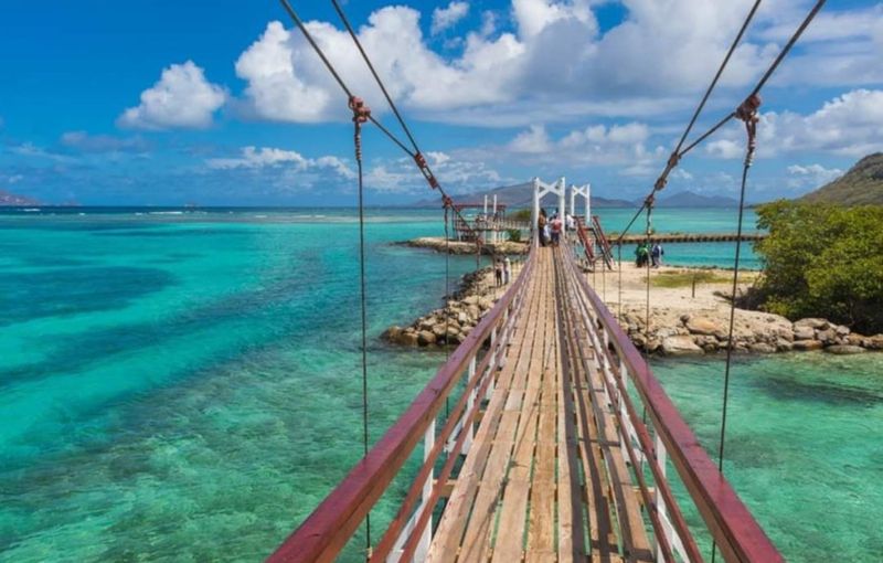 New twin suspension bridges over breached gaps in failed marina causeway in the Ashton Lagoon (Photo by Sustainable Grenadines, Inc.)