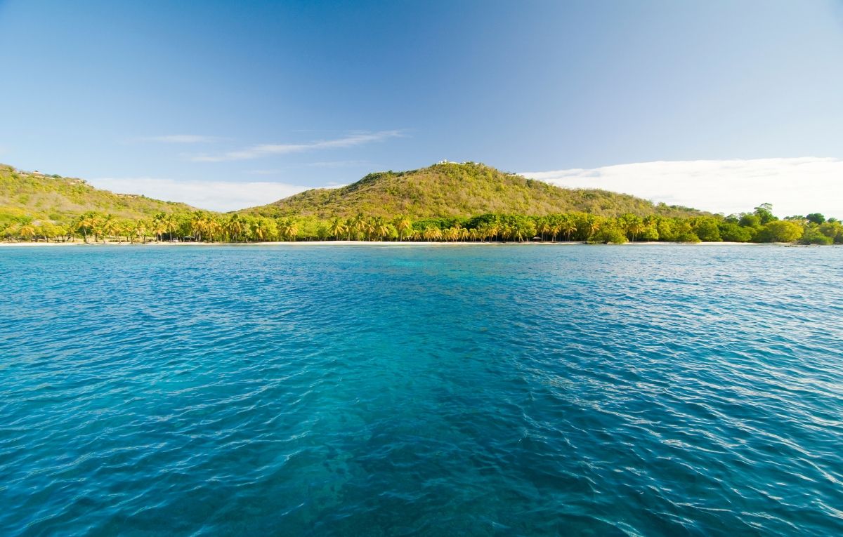 Mustique Paradise - blue sea water and green island