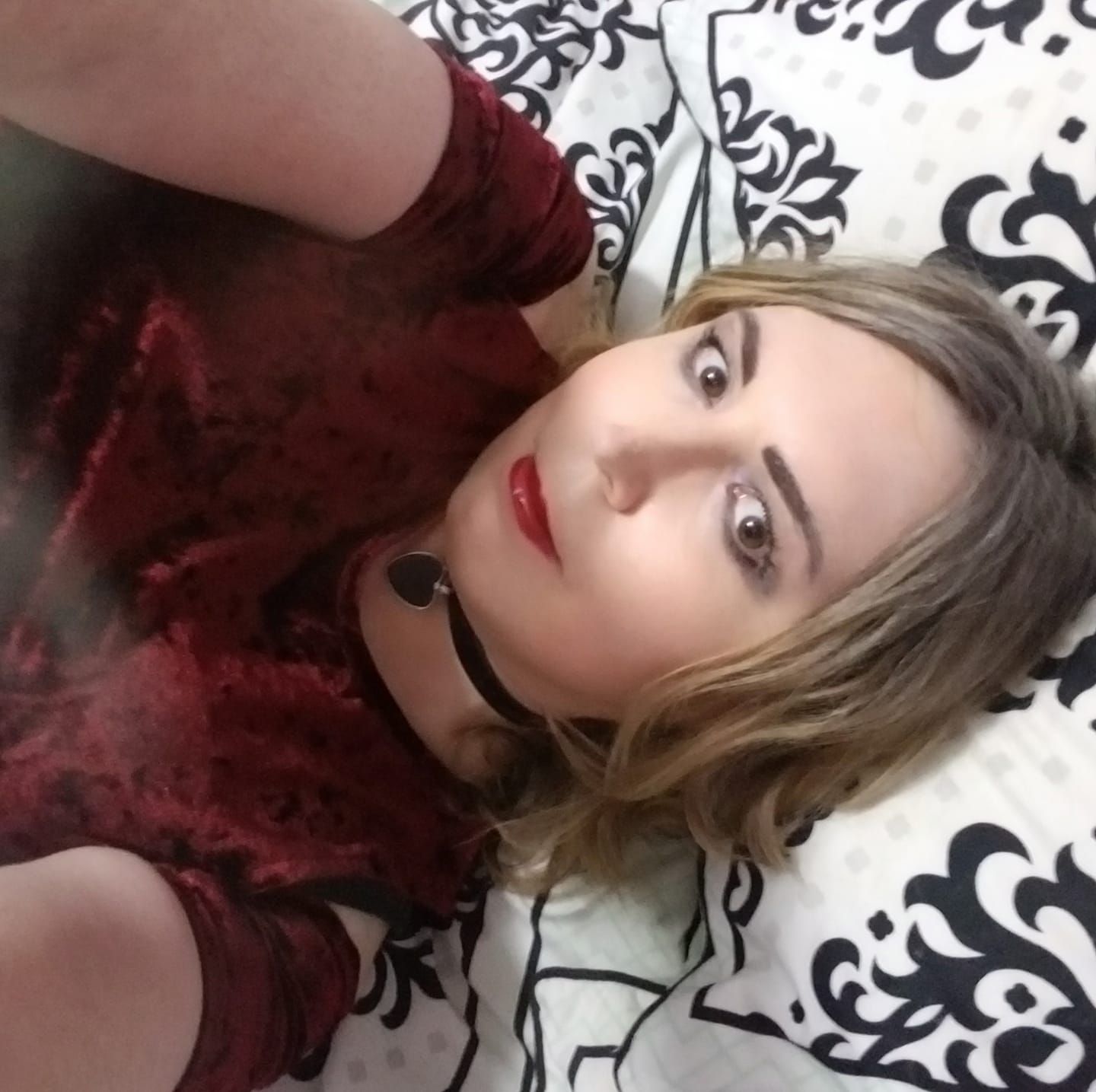 jen sitting on bed