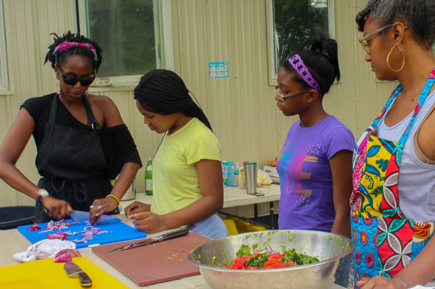 Reviewing knife skills, Our Mothers' Kitchens Camp, 2017. Photo: Gabrielle Clark.