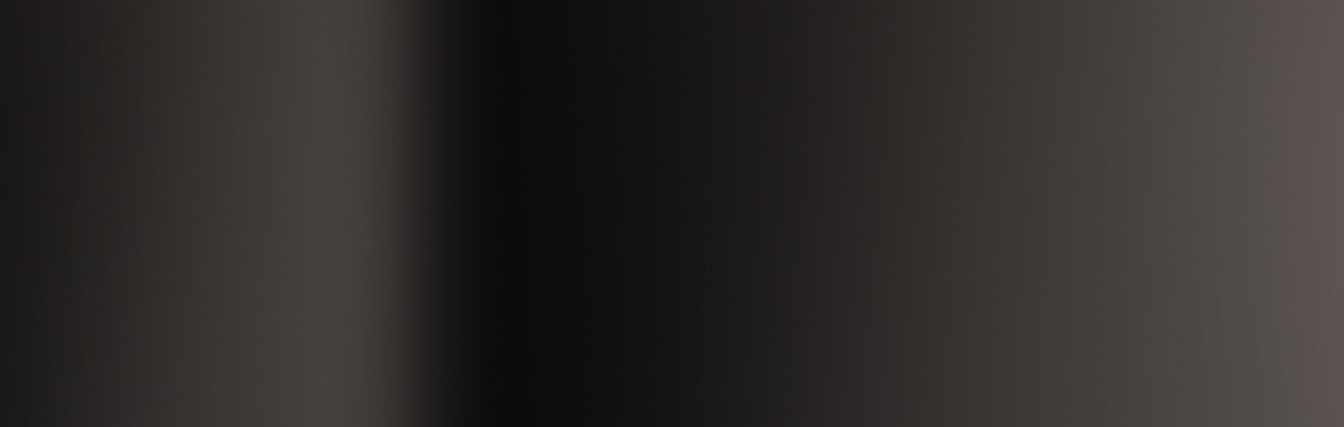 Dark vertical gradient from grey to black and back to grey.
