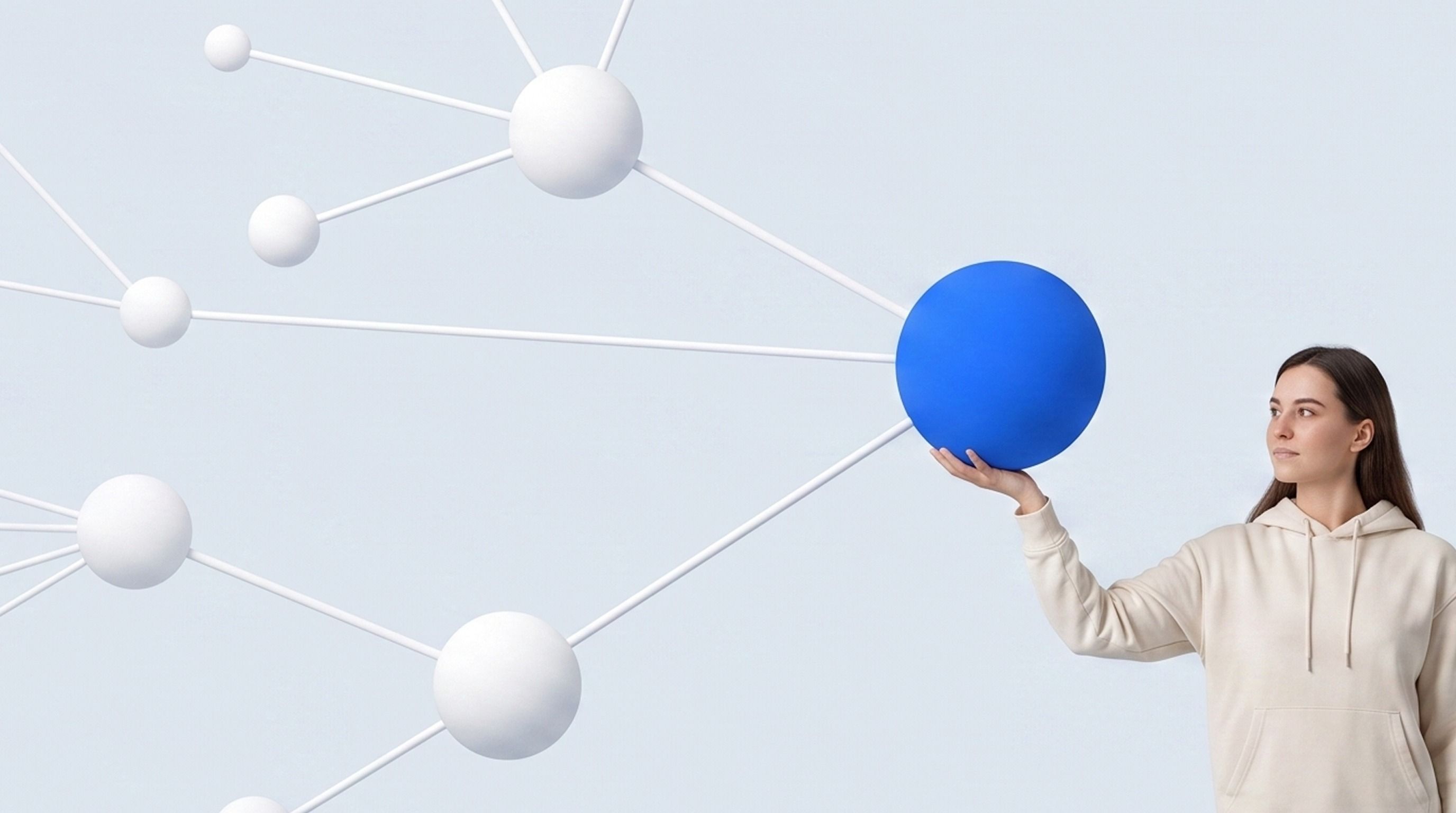 Woman holding a blue sphere that is a central node in a network of white spheres and lines.
