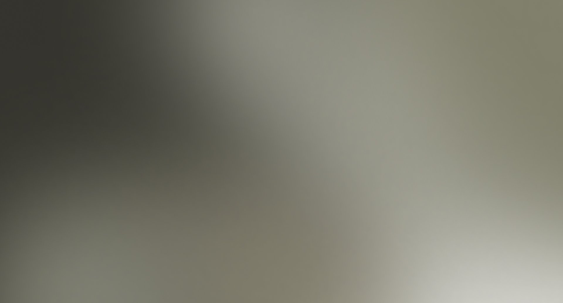 Soft gradient from dark gray to light gray.
