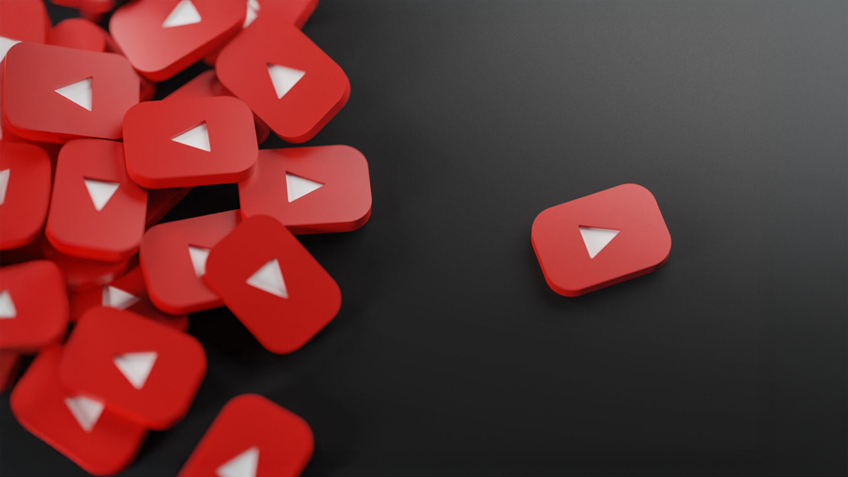 Multiple red YouTube play button icons scattered on a dark background.