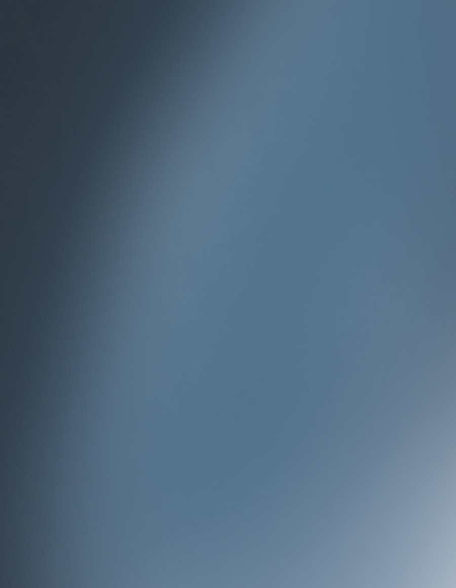 Smooth dark to light blue-grey gradient.