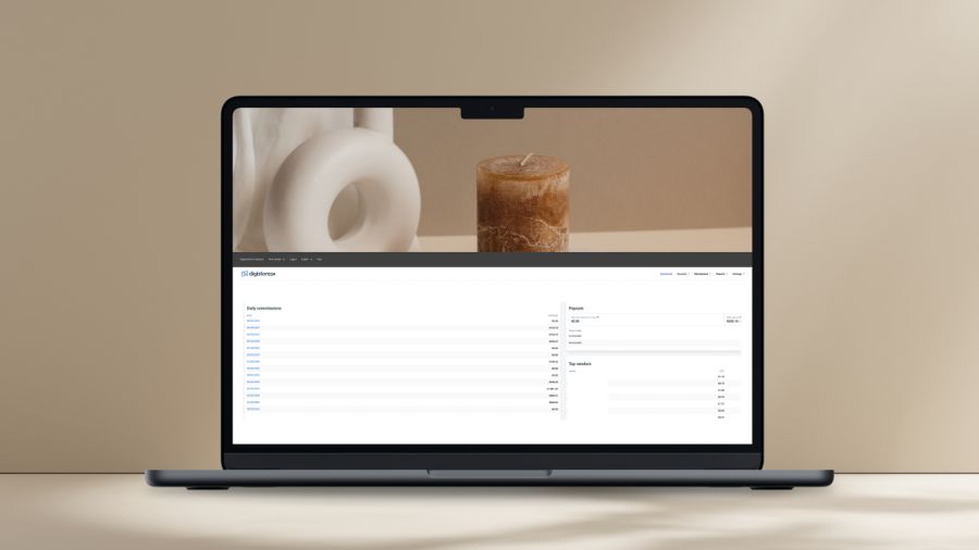 A dark laptop displays a still life image above a data dashboard, set against a beige background.