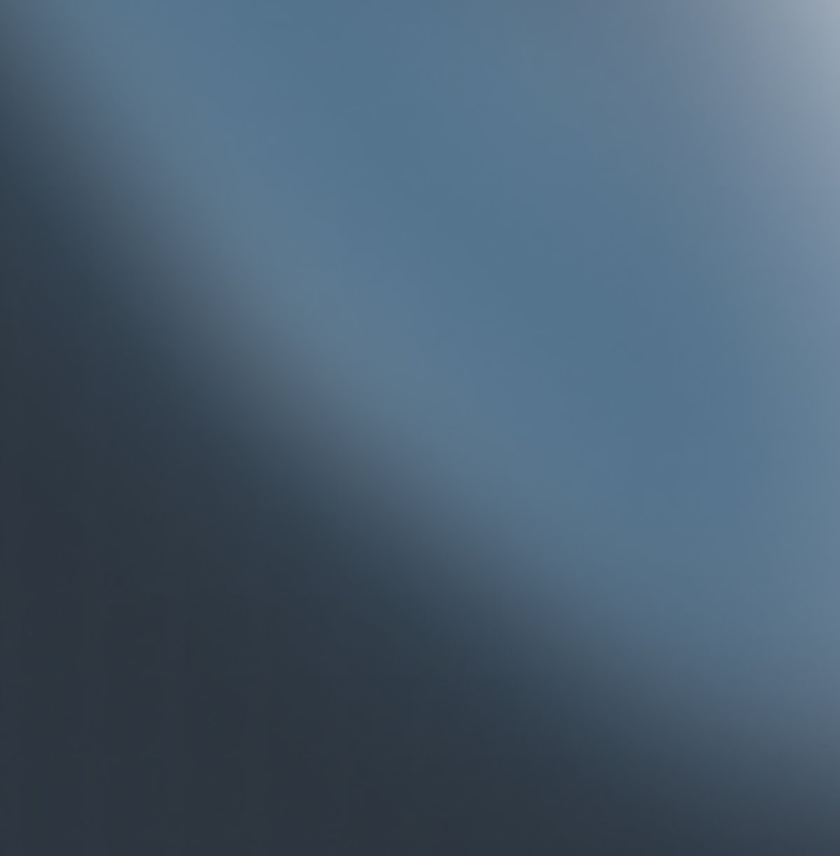 Smooth gradient from dark blue-gray to light blue-gray.