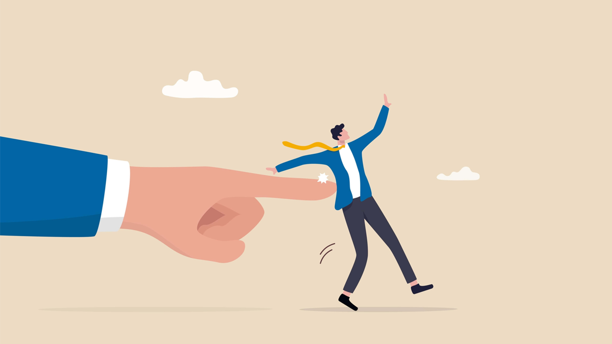 A large finger pushes a businessman backward, causing him to stumble, symbolizing dismissal.