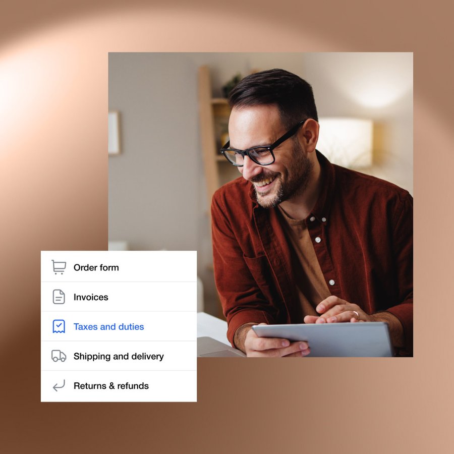 Smiling man using a tablet.