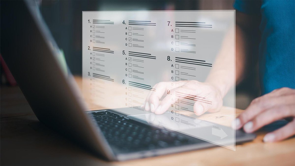 Hands interact with a laptop, featuring a translucent digital questionnaire overlay.