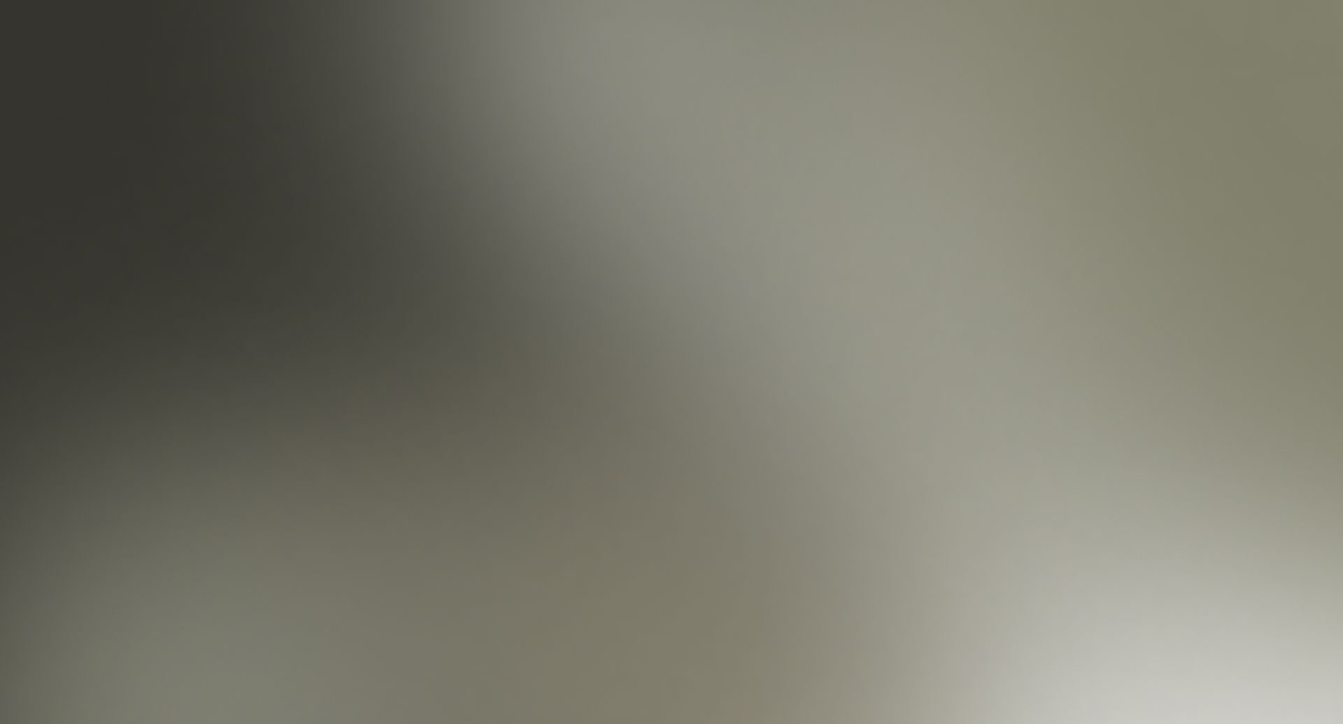Soft gradient from dark gray to light gray.
