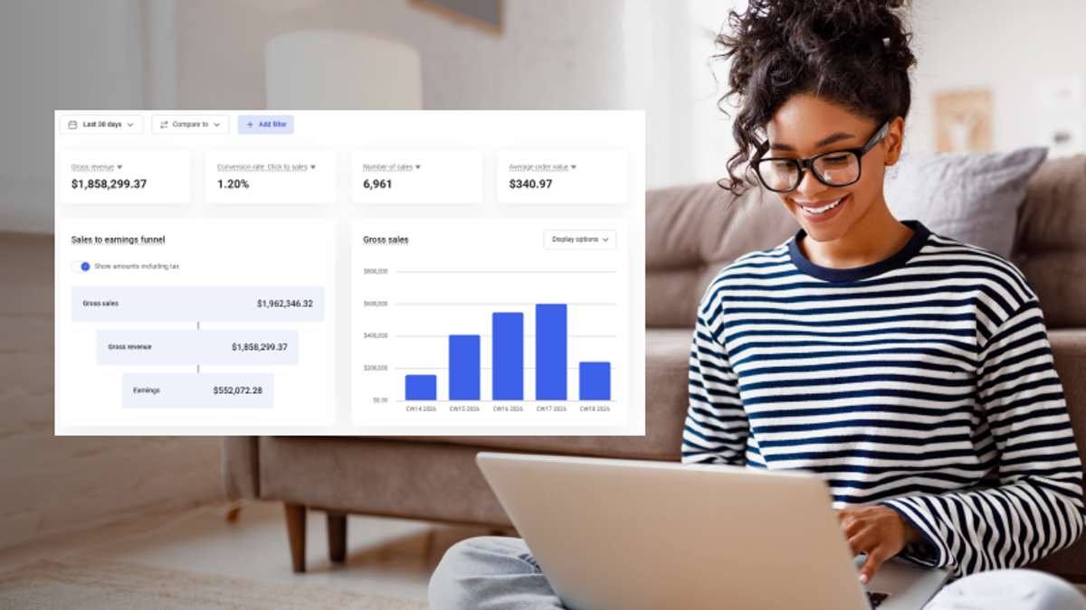 Smiling woman with glasses using a laptop, with an overlaid digital dashboard showing sales and earnings, including over $1.8M gross revenue.