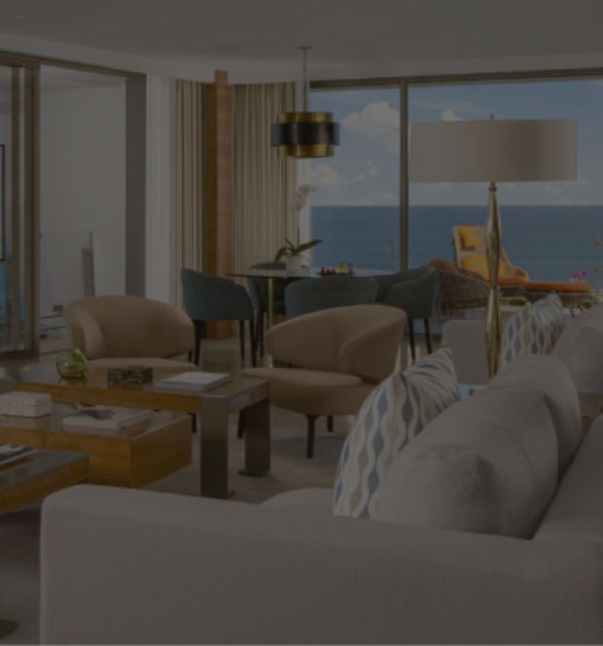 Luxurious living room overlooking the ocean, with a balcony featuring a telescope.