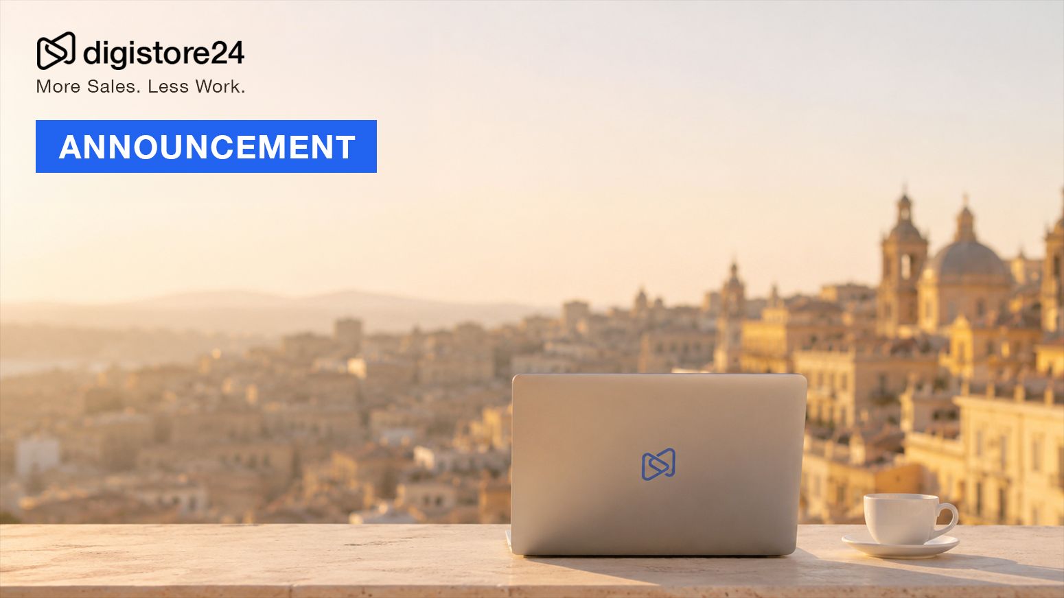 Digistore24 logo and slogan "More Sales. Less Work.", with a blue banner reading "ANNOUNCEMENT". A laptop with the Digistore24 logo and a coffee cup sit on a railing overlooking a blurred, sunlit cityscape.