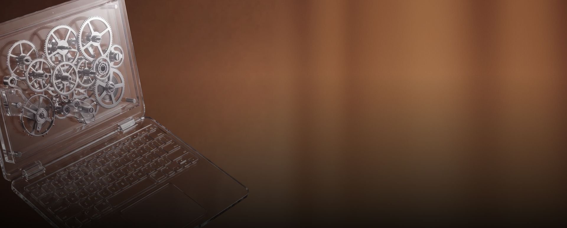 Transparent laptop showing gears on a brown background.
