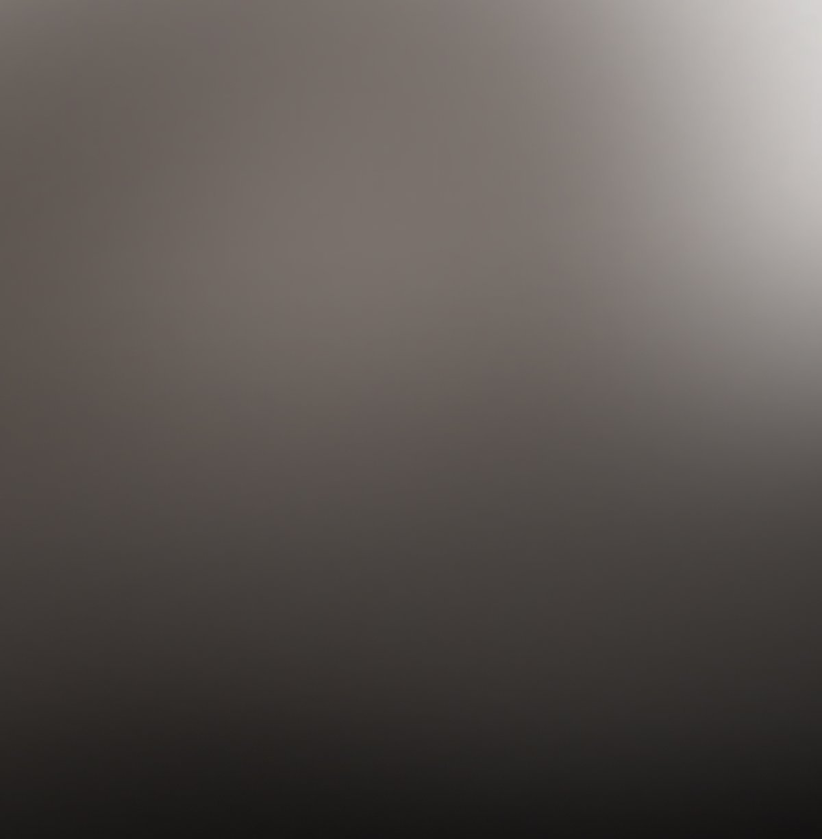 Dark gray gradient background with a subtle highlight in the upper right corner.