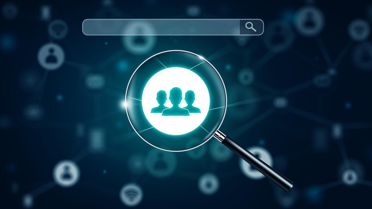 Magnifying glass highlighting a group of people icon, with a search bar and digital network background.