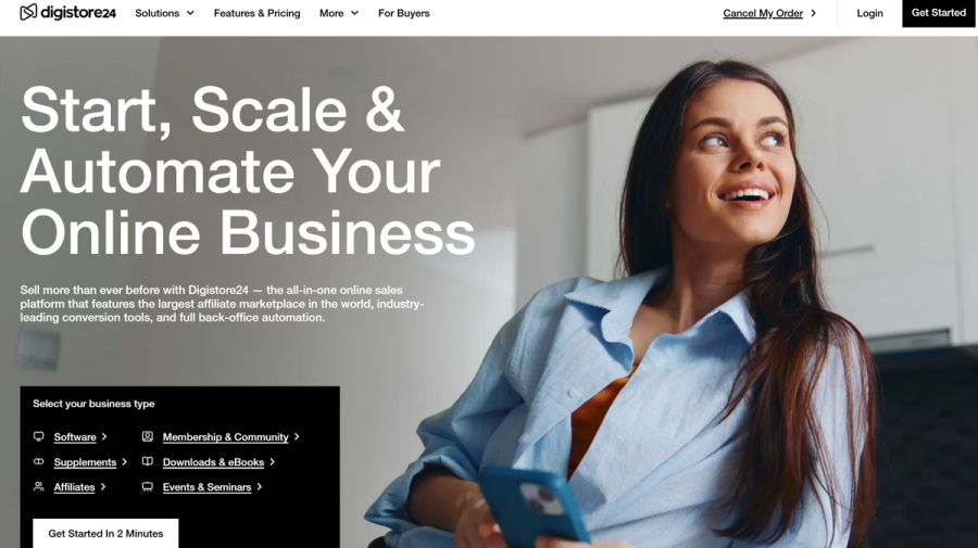 Digistore24 website landing page with a smiling woman holding a phone, next to the headline "Start, Scale & Automate Your Online Business".