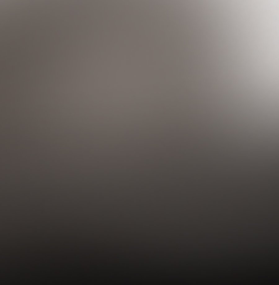Smooth gray gradient from dark to light, with a bright spot in the upper right corner.