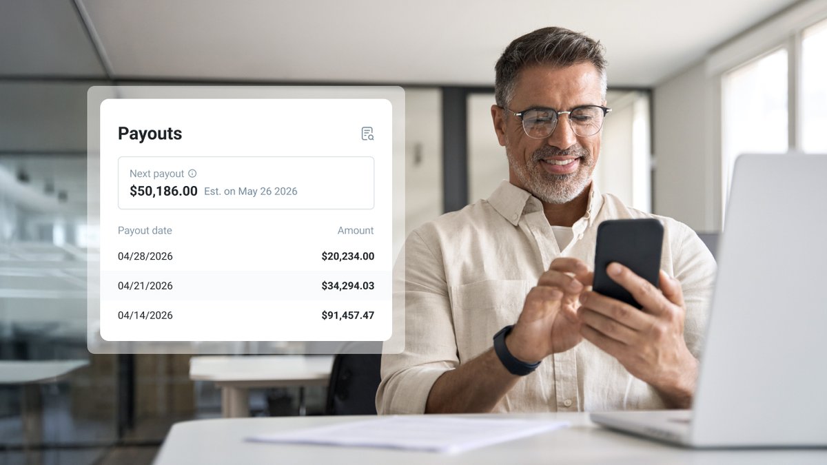 Smiling man uses a smartphone while a transparent overlay displays "Payouts" details including future and past amounts.