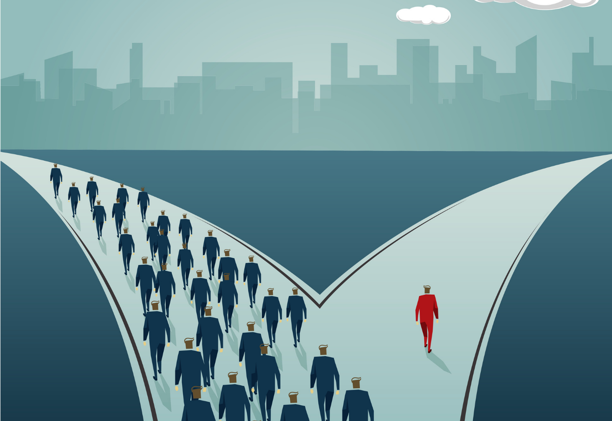 A crowd in dark suits follows one fork of a path, while a lone person in a red suit takes the other.