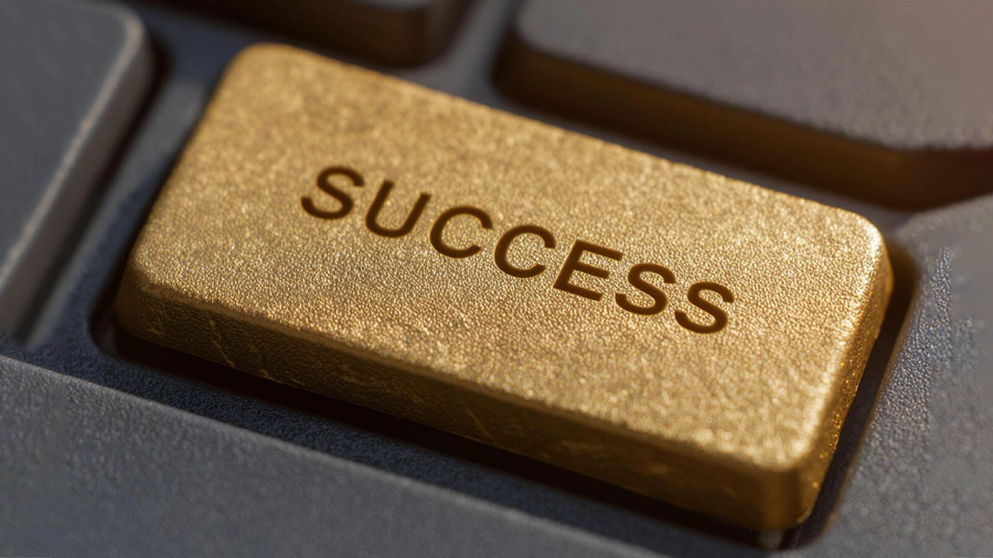 A golden keyboard key with the word "SUCCESS" embossed on it.