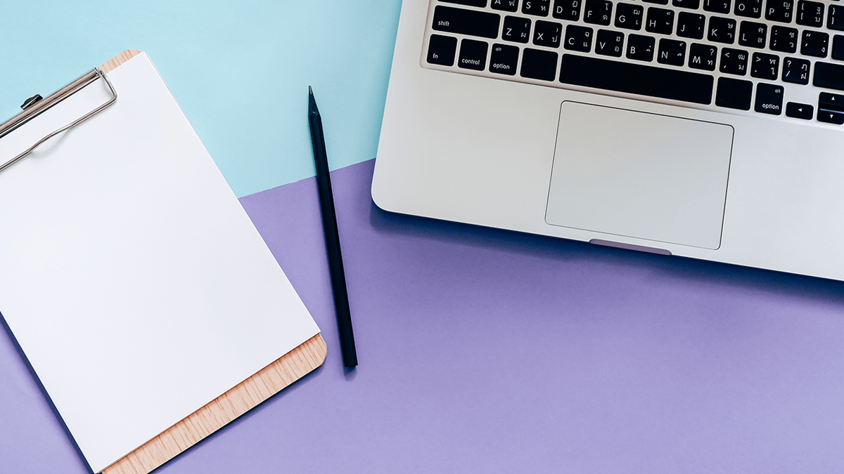 A clipboard with blank paper, a pen, and a laptop on a pastel blue and purple background.