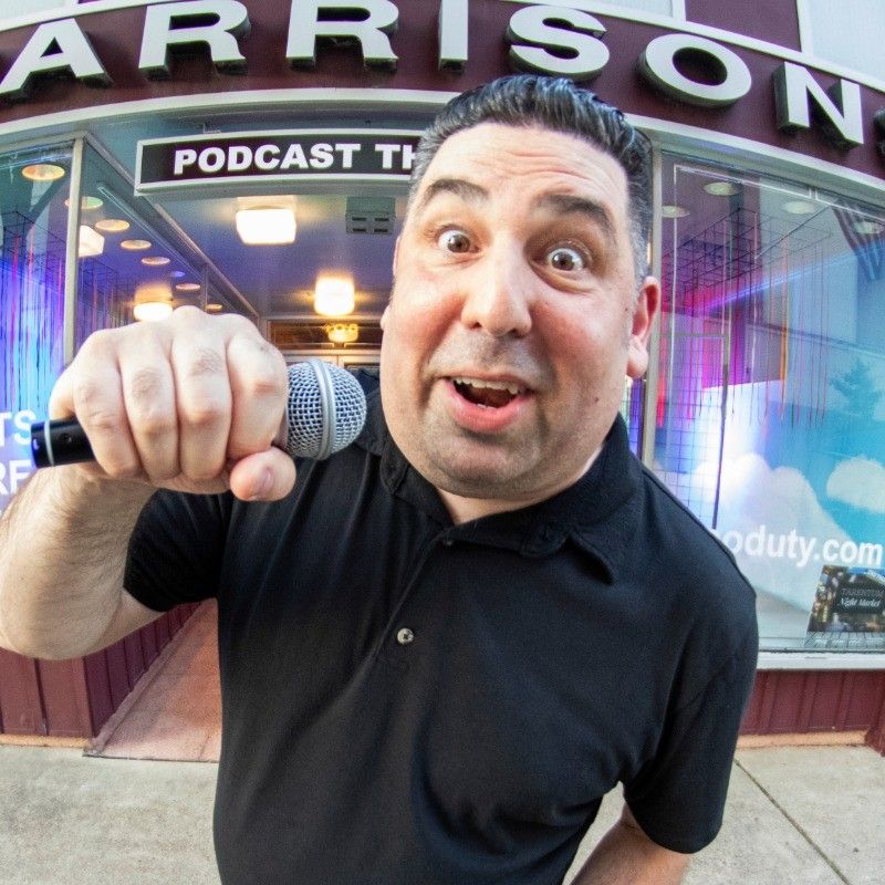 A surprised man holds a microphone in front of a "Podcast Th" sign.
