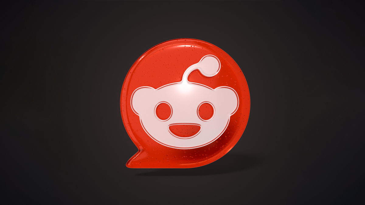 A 3D glossy red Reddit logo in a speech bubble.