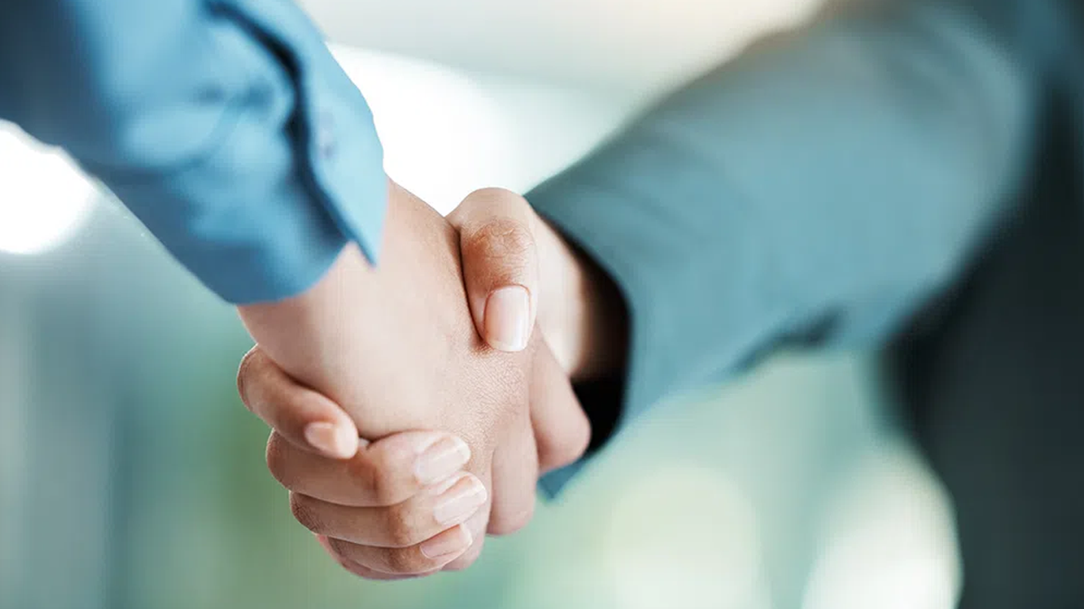 Two people shaking hands.