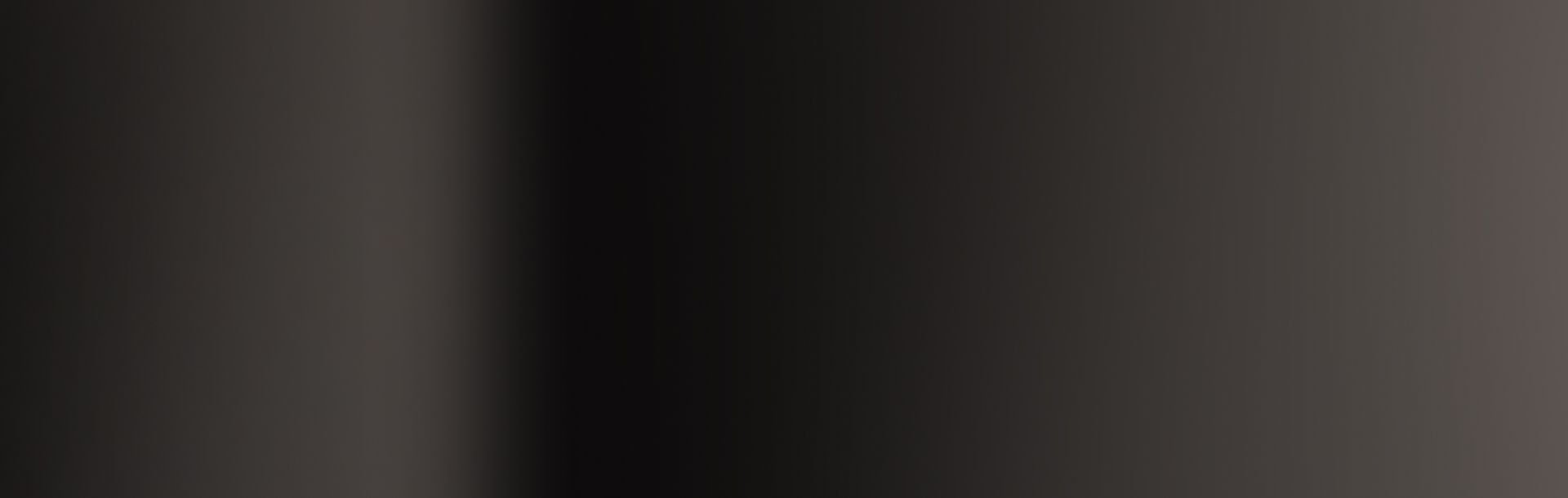Dark vertical gradient from grey to black and back to grey.