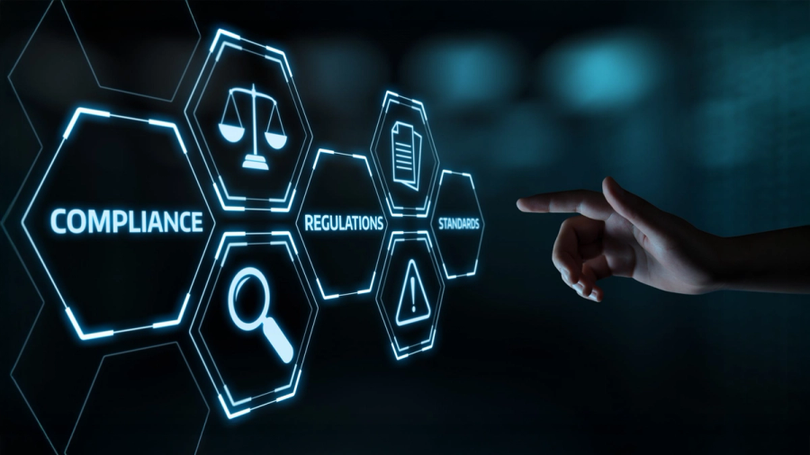 Digital interface with glowing hexagonal icons for 'Compliance,' 'Regulations,' and 'Standards,' with a hand pointing to 'Standards.'