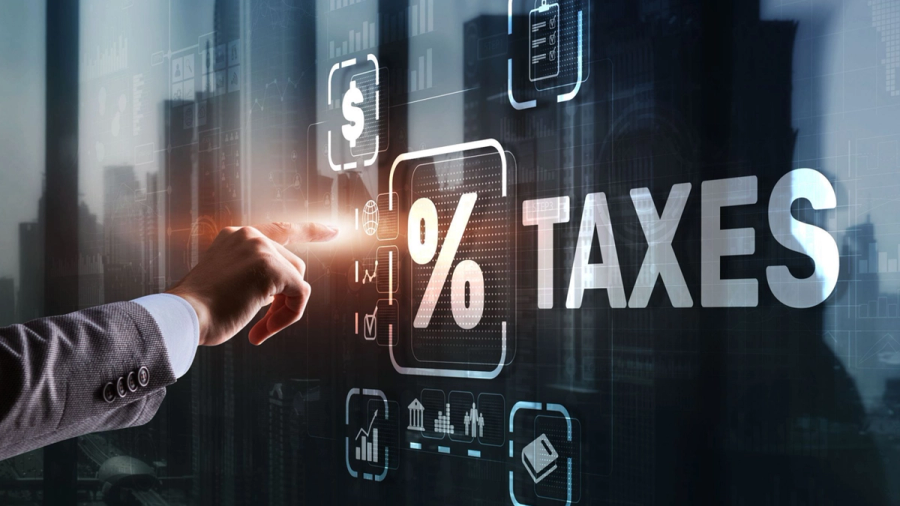 A hand interacting with a digital display featuring the text '% TAXES' and financial icons.