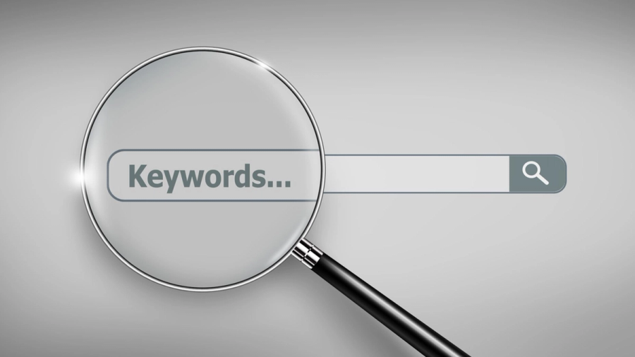 Magnifying glass over a search bar with "Keywords..." typed in it.