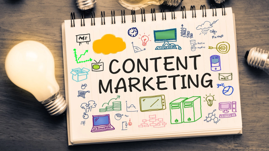 A notebook with "CONTENT MARKETING" and various related icons, illuminated by a glowing lightbulb.