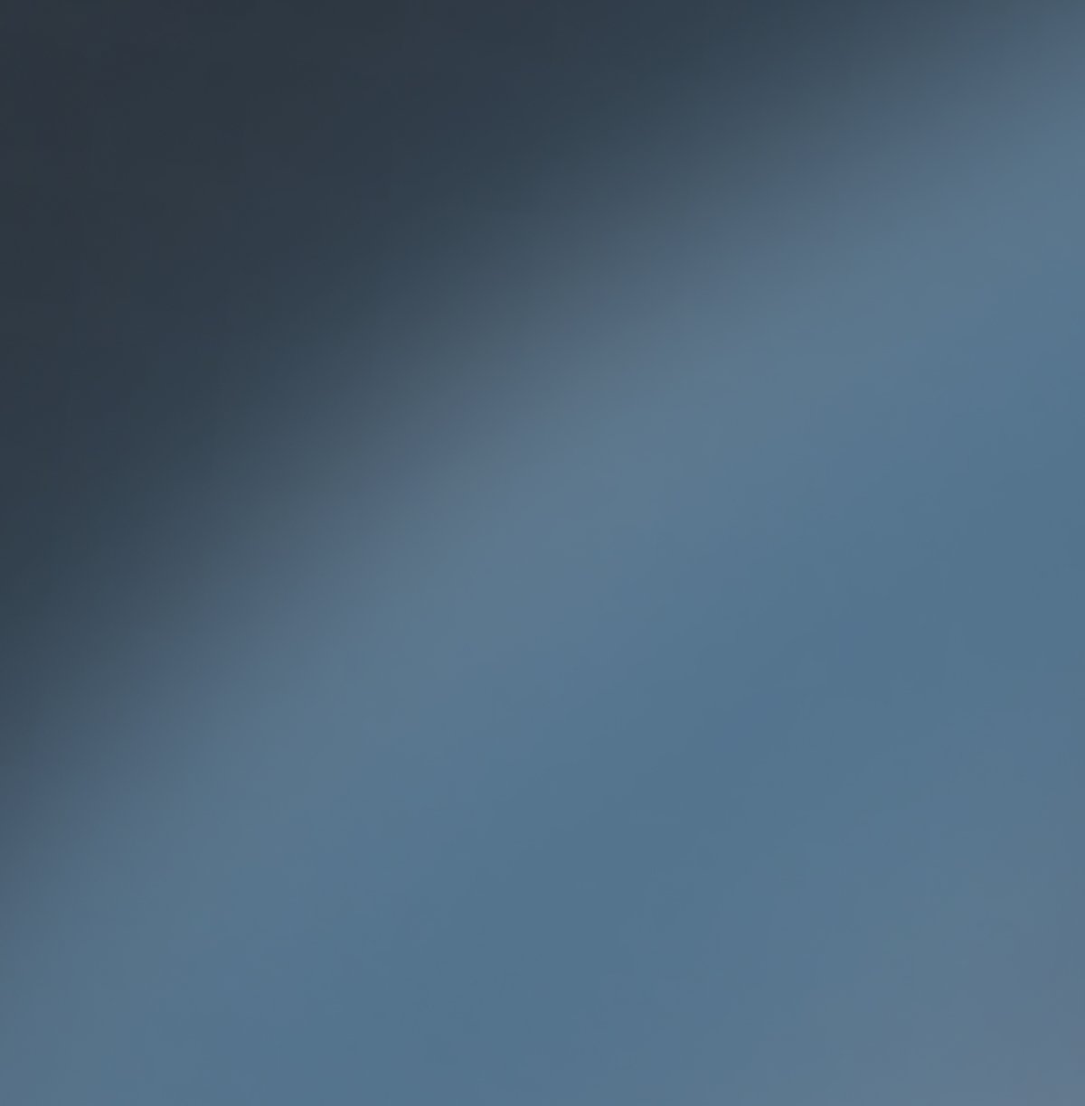 Dark blue-gray to light blue gradient.