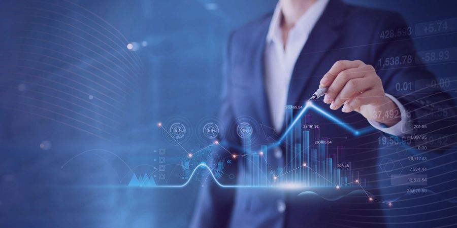 Business person interacting with an upward-trending holographic financial chart.