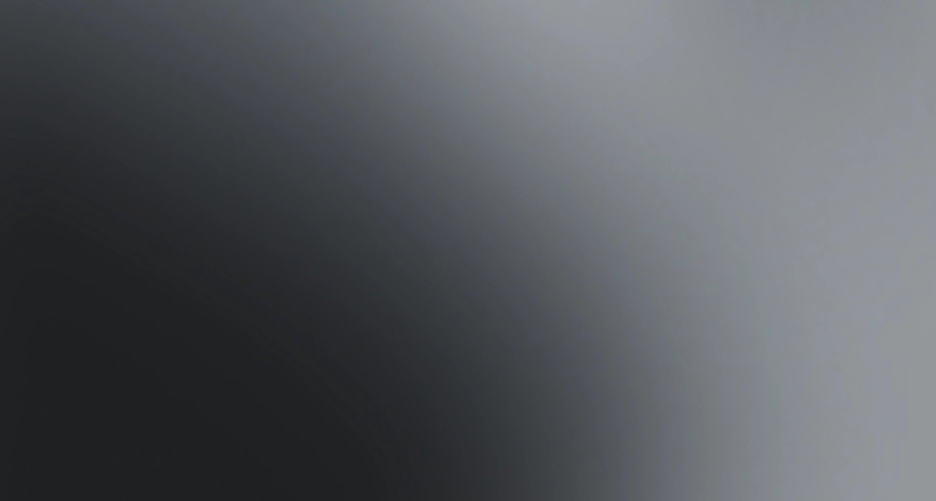 Dark grey to light grey horizontal gradient.